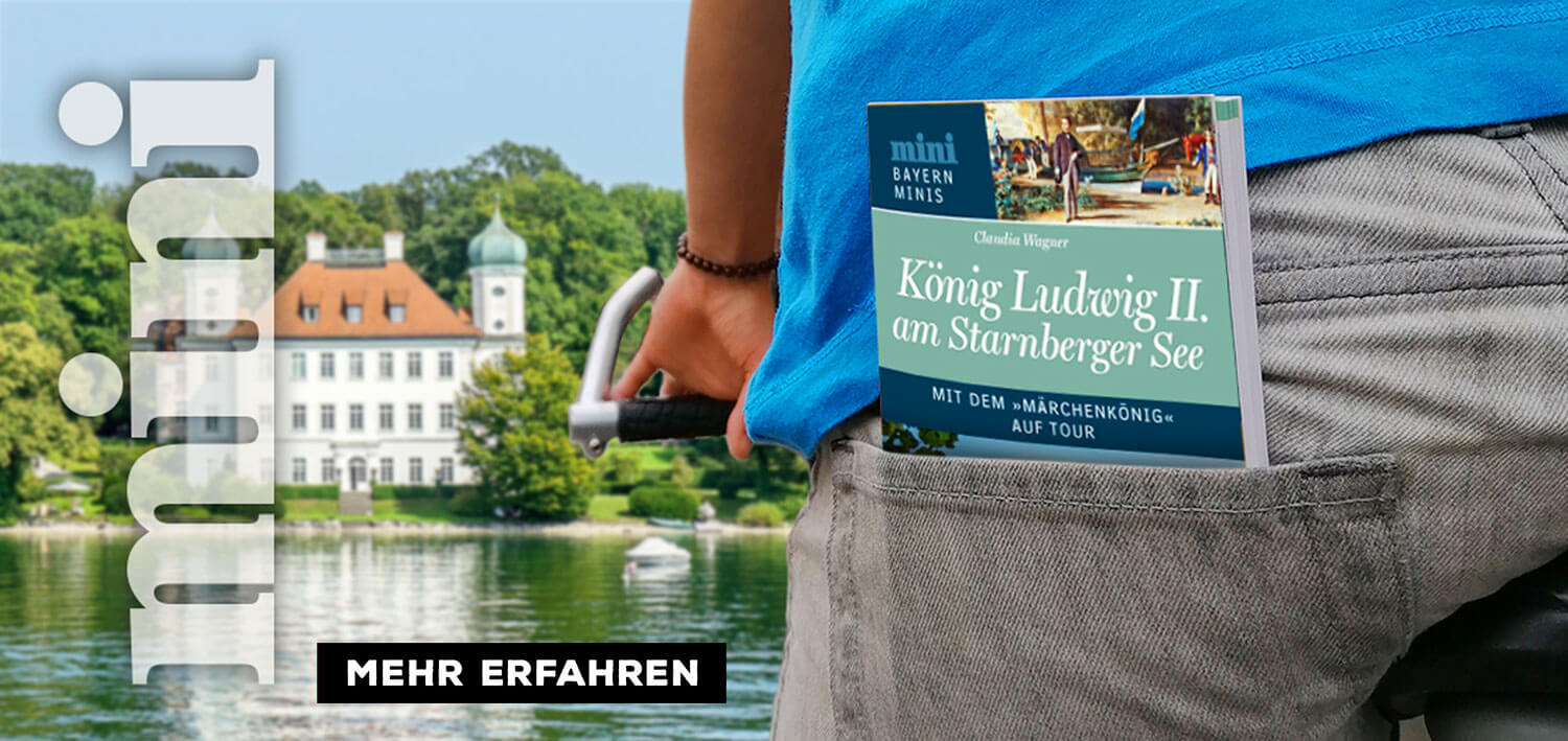 Mini-Reisefüherer König Ludwig am Starnberger See steckt in der Hosentasche eines Radfahreres