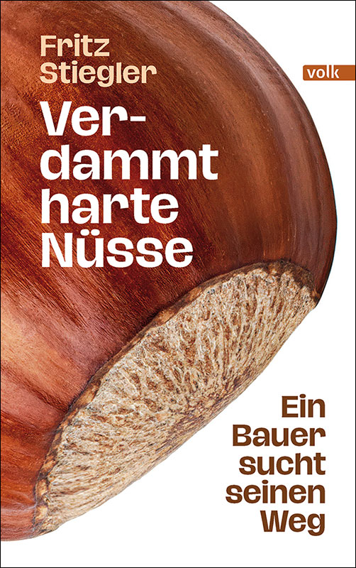 Ein weißes Buchcover, auf dem eine große Haselnuss zu sehen ist.